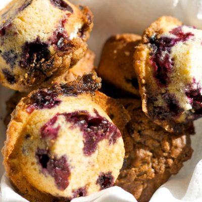Blueberry and banana muffins on a plate.