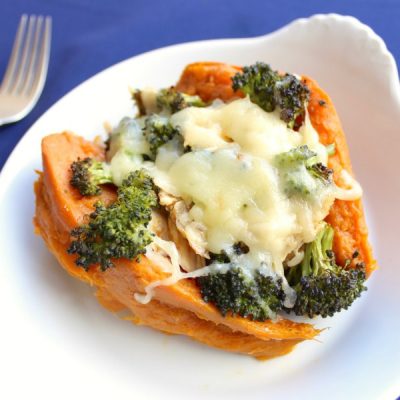 Barbequed sweet potato cut in half, stuffed with broccoli, mozzarella cheese and chicken breast.