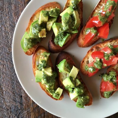 Toasted French bread topped with avocado with blended mix of parsley, cilantro, and garlic.
