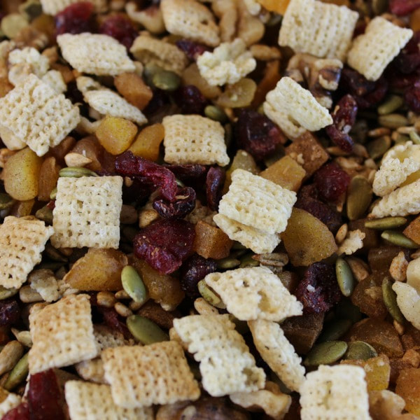 Trail mix made with dried apricots, dried cranberries, walnuts, pumpkin seeds, and sunflower seeds