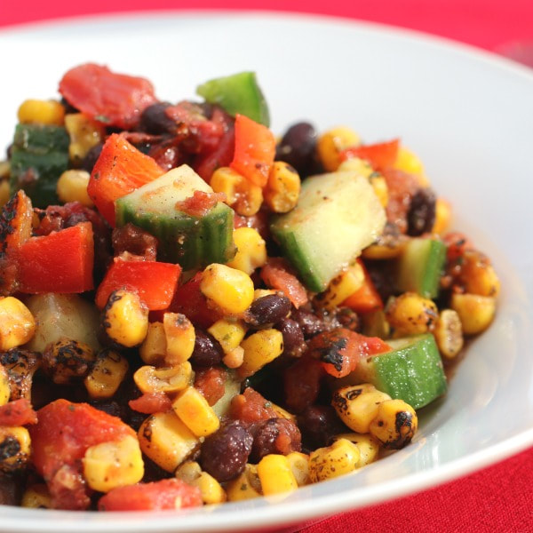 Mixed corn kernels, stewed tomatoes, black beans, green and red peppers, and chopped cucumber.