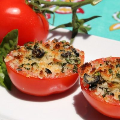 Halved stuffed tomatoes with Italian bread crumbs and minced basil topped with parmesan cheese.